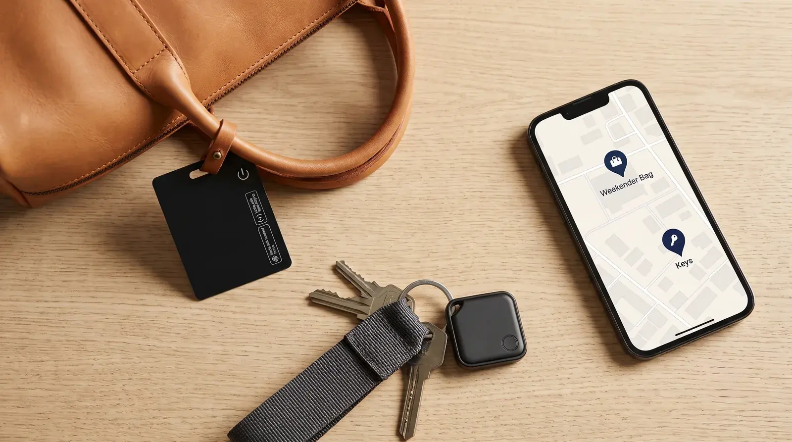 Qivari Card and Tag tracked live on a phone map, on a leather bag and keys